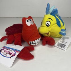 The Disney store little mermaid plushies