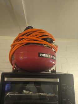Portable air compressor with hose reel