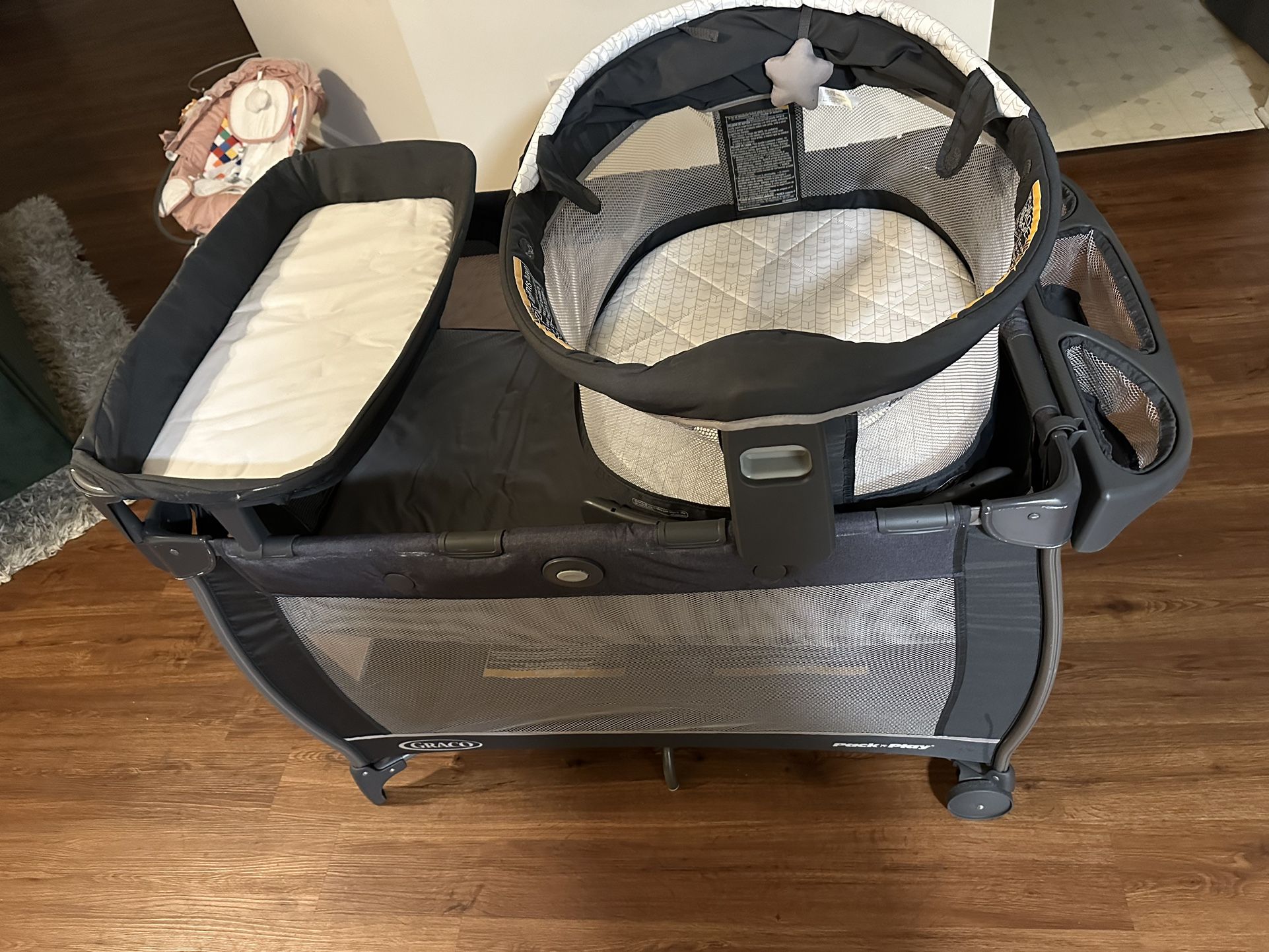 Graco Pack n Play Dome Playard with Baby Bassinet, Lightweight Portable Push-Button Fold Travel Crib