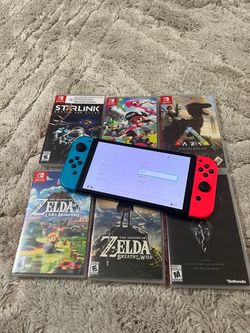 nintendo switch oled with 6 games
