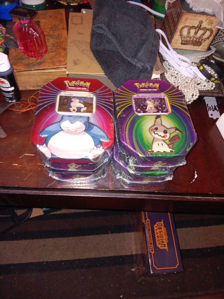 4 Pokemon Collectors Tins And 1 Pokemon Blister Pack