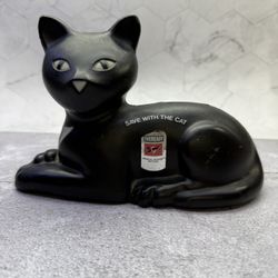 Vintage Eveready "Save with the Cat" coin bank from 1981. It is a promotional item made of plastic by Union Carbide Corporation for Eveready batteries