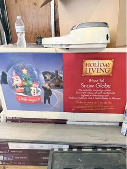 Inflatable snow globe