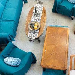vintage oak parquet or herringbone-patterned coffee table with a warm honey finish, soft rounded corners, and a geometric wood grain design.