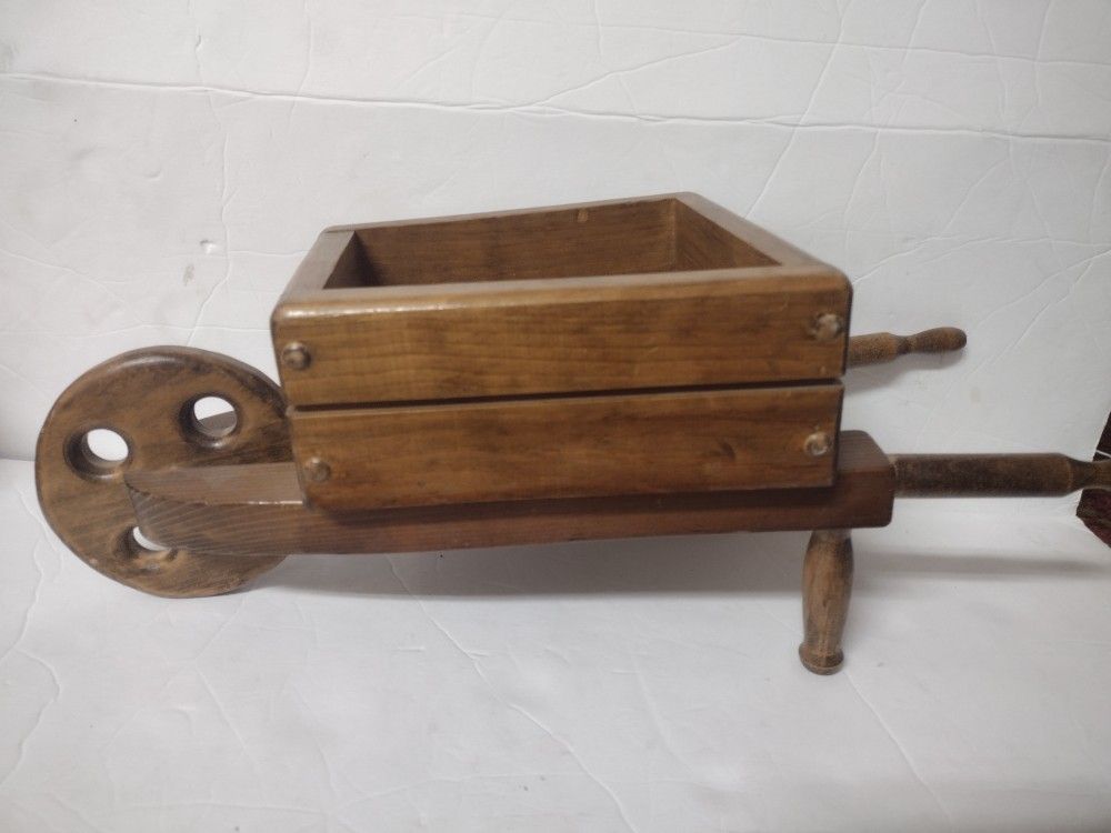 Vintage heavy wood wheel barrow planter. Cute wheel barrel for dolls, plants, de