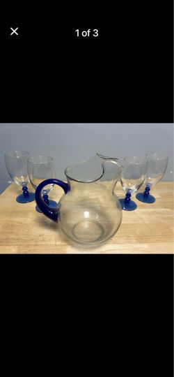 Pitcher with 4 glasses.