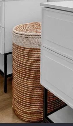 tall, cylindrical laundry hamper natural woven material with lid