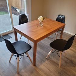 Brown Wooden Table And 4 Black Chairs