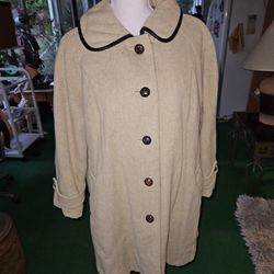 vintage women's Beige  wool coat by Penguin Fashions, likely from the 1960s