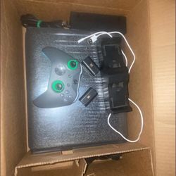 Xbox One X with two rechargeable batteries, a charging dock all cables one controller it’s new