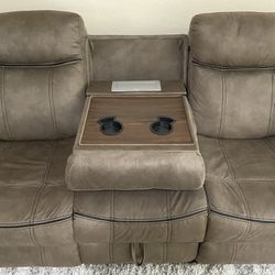 Reclining Sofa and Rocking Loveseat With Consoles, Outlets, and Storage