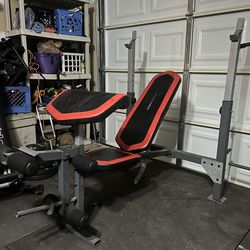 Weight bench with lat pull leg extension and arm rest