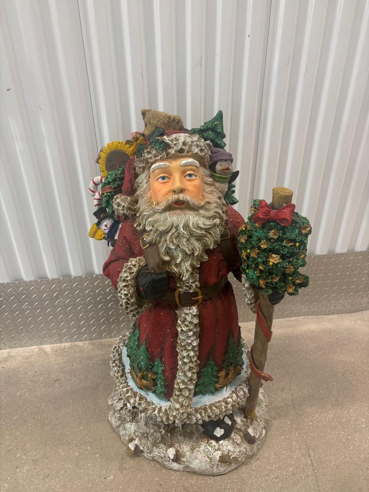 Santa bearing  gifts decorating statue… solid and steady … 37” tall. $60