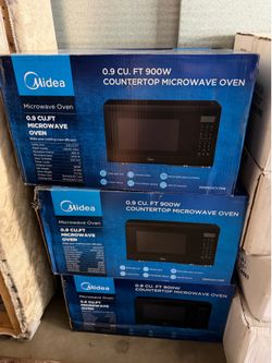 Brand new in box microwave Midea 0.9 cu ft