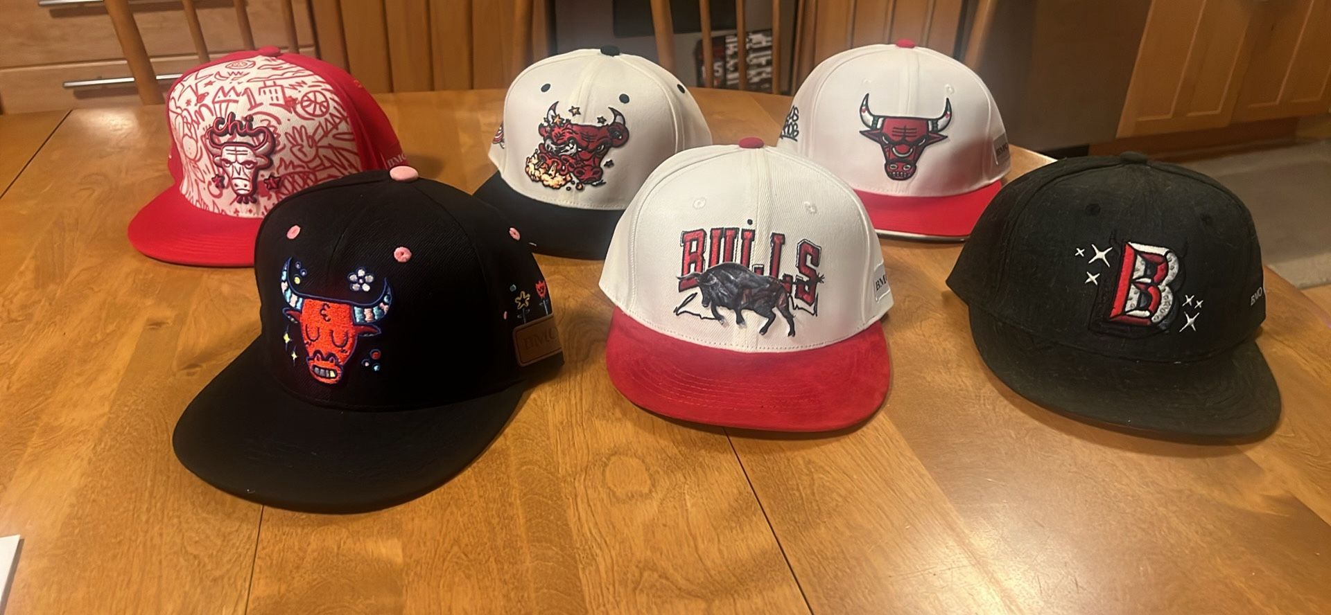 Chicago Bulls BMO bank bulls hat package. Package of six hats all new. Wheeling All hats new in excellent condition Selling as a package of sex other