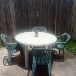 PATIO SET.    TABLE WITH 7 CHAIRS.  