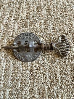 Vintage cast iron reversible spindle.