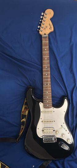 Black Stratocaster-Style Electric Guitar with stand