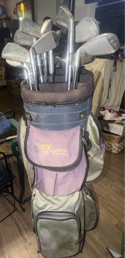 Vintage Viper brand golf bag with various irons and woods, which is typical for a complete, pre-owned bag typically bought at secondary markets . Aski