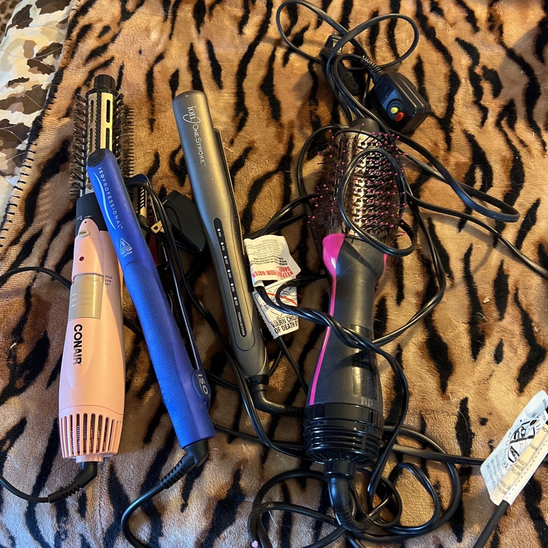 Two Blow Dryers And Two Straighteners