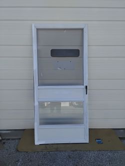Nice White Storm Door With Doggy Window & Screen Plus Striker Very Clean Like New. 
