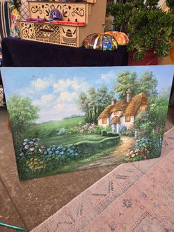 An oil painting on canvas; it appears to be a decorative landscape-style work signed by C. Jaffey.