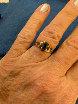 SAPPHIRE RING. EMERALD CUT WITH SAPPHIRES DOWN THE SIDE. THICK BAND SIZE 6