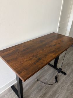 Wooden standing desk with adjustable height