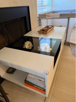 White and black coffee table with glass top
