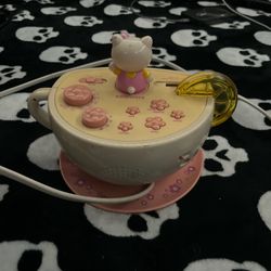 Hello kitty alarm with working am/pm radio and lights up 