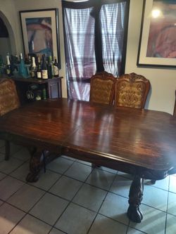Red wood table with 4 chairs