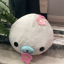 seal plushie with flowers