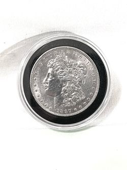 About uncirculated sealed in capsule 1897-P Morgan Silver Dollar