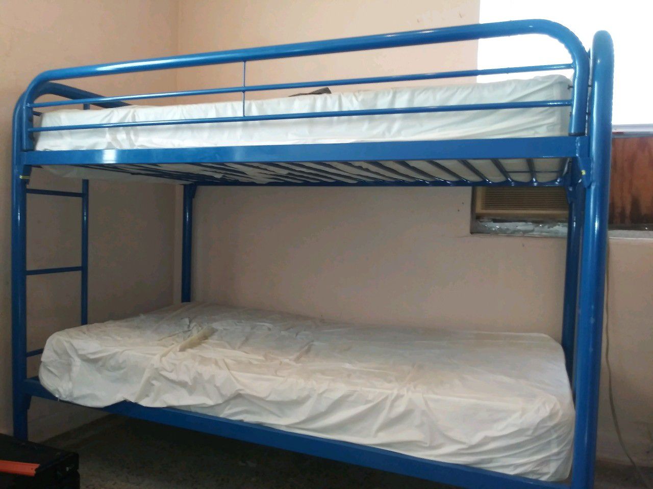 Gray metal queen size with headboard and footboard no mattress bed. And blue metal twin size bunk beds with mattress