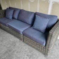 Gorgeous, gray wicker outdoor patio four piece modular sofa sectional set with plush deep seating in excellent condition. Less than a year old and onl