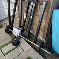 Used Squat Rack With Small Barbell And Weights 