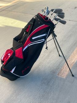 Set of golf clubs and bag with stand and shoulder strap asking 125