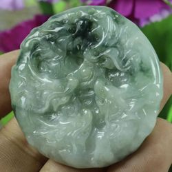 Certified green 100% natural A jade grade carved 9 Dragon spit pearl. Pendant