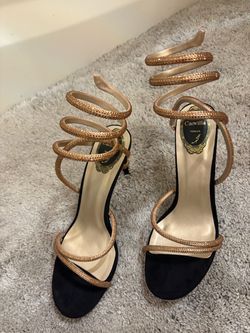 Gold and black high heels, and