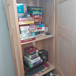 Game Board Cabinet With Certain Board Games