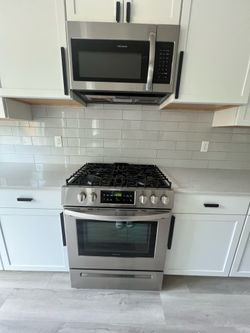 Frigidaire Gas Range and microwave set