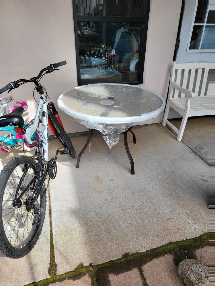 New patio table $39 24" by $100 26" bike $125