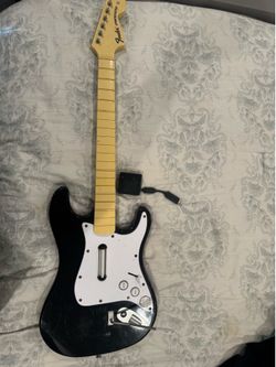 Rock band guitar with dongle