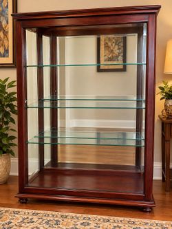 Howard Miller Cherry/Glass Curio Cabinet