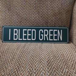 EAGLES FANS "I BLEED GREEN" METAL SIGN.  16" X 4".  NEW.  PICKUP ONLY.
