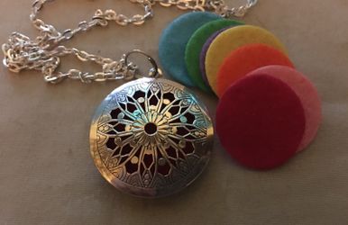 Silver Essential Oil Diffuser Necklace Aromatherapy Locket Pendant w/ Washable Colored Pads Silver Plated Metal Type: Alloy Chain is 28 inches long