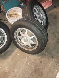 14-inch OEM Honda Civic HX aluminum alloy wheel (by Enkei) fitted with MICHELIN TIRES