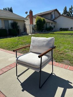 Modern, comfortable armchair with upholstered armrests