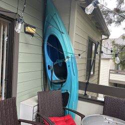 Kayak With Paddles And Life Jacket