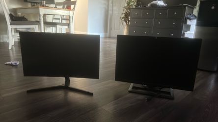 Two Black Desktop Computer Monitors with Stands